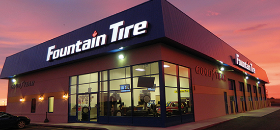 Fountain Tire location with a sunset in the background